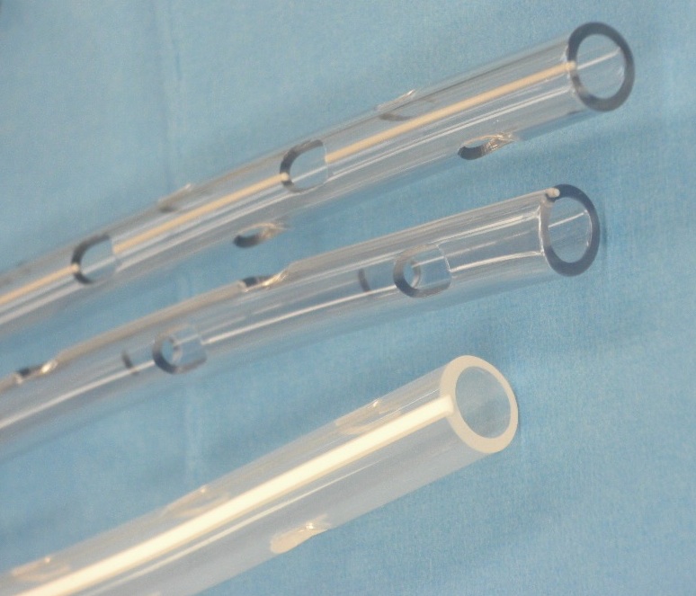 Chest tube drainage holes.